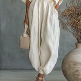 Off-White dámsky ľanový set s off-shoulder topom a tapered nohavicami